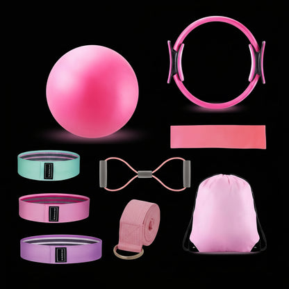  various pink fitness products including a ball, resistance bands, and a drawstring bag on a black background.